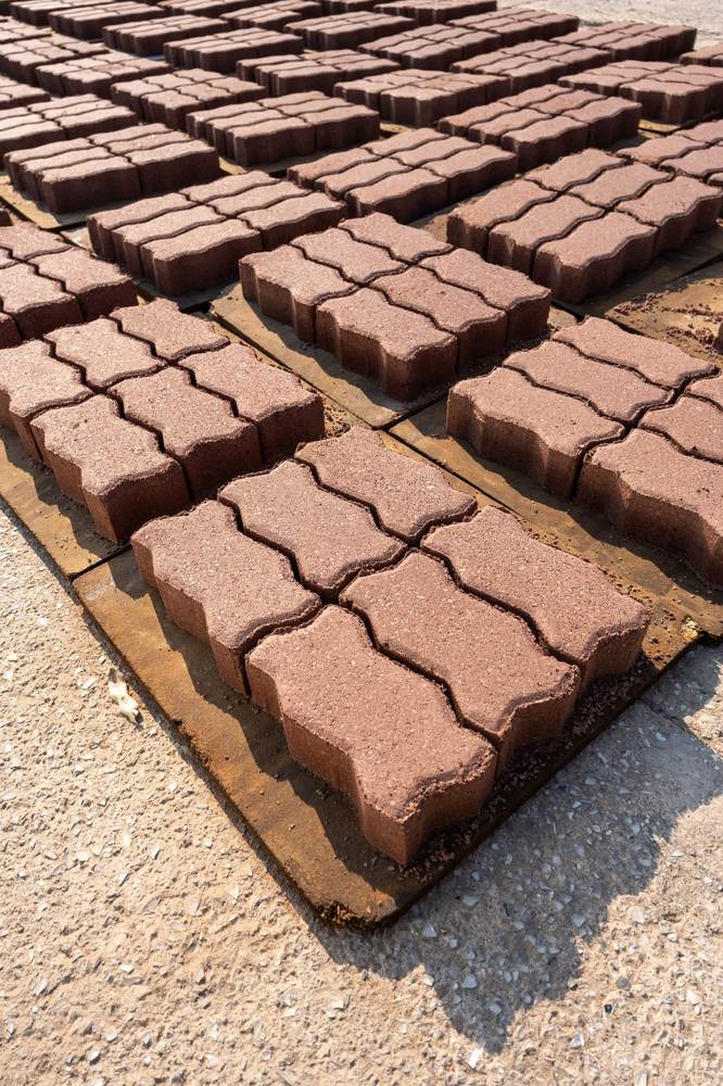 Rows of Interlocking Eco-Pavers made from recycled solar panel and lighting glass drying at the EWaste Africa facility